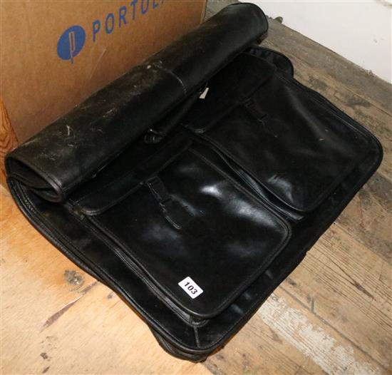 A black leather suit bag